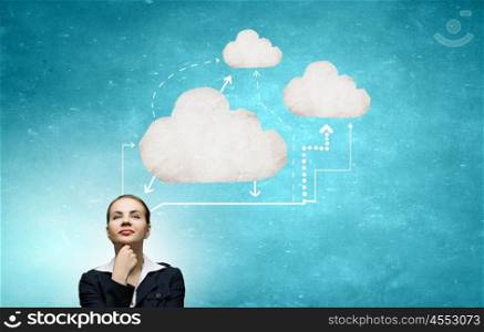 Cloud computing concept. Thoughtful businesswoman and cloud computing concept on blue background