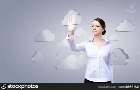 Cloud computing connection. Attractive businesswoman touching cloud icon on screen