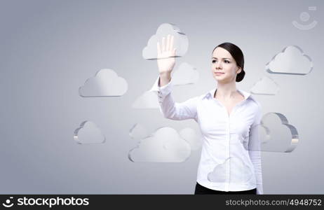 Cloud computing connection. Attractive businesswoman touching cloud icon on screen