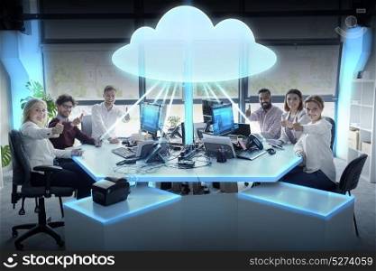 cloud computing, future technology and people concept - business team with tablet pc and computers showing thumbs up at office. happy business team with cloud computing hologram