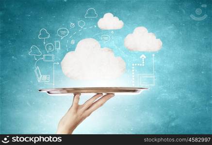 Cloud computing. Hand holding tray with cloud computing concept