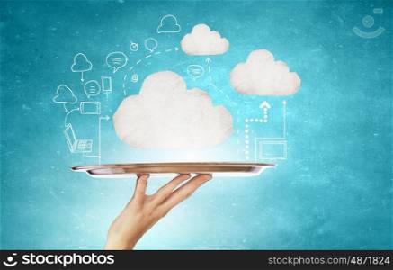Cloud computing. Hand holding tray with cloud computing concept