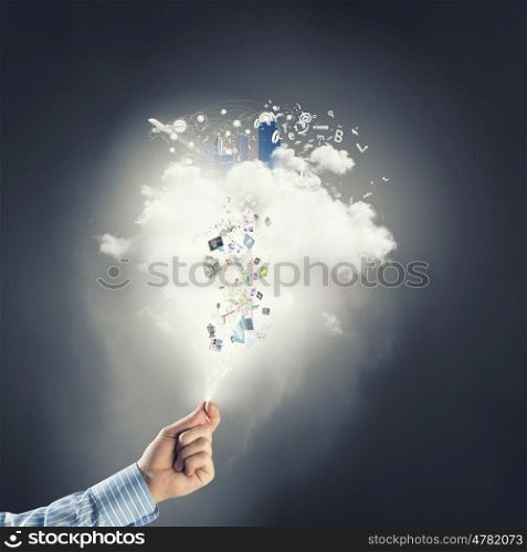 Cloud computing. Hand of businessman catching cloud with business icons