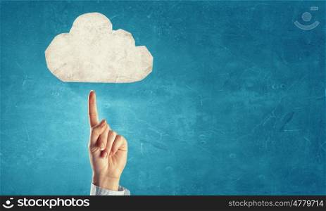 Cloud computing. Hand pointing with finger at cloud on color background