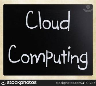 ""Cloud computing" handwritten with white chalk on a blackboard"