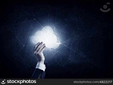 Cloud computing icon on digital background. Businessman hand showing cloud network idea concept