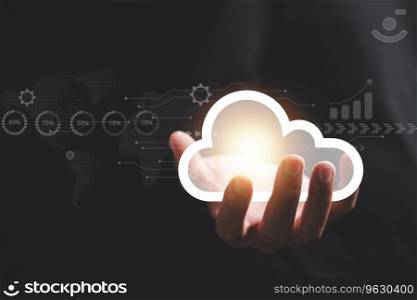 Cloud computing technology in action, a man access the server network holding cloud on hand on black background, and storage services with global marketing support, a concept for online businesses. 