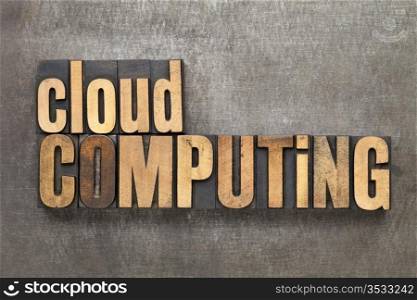 cloud computing - text in vintage letterpress wood type against a grunge metal sheet