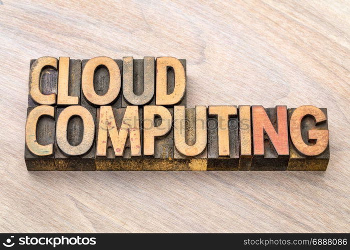 cloud computing - word abstract in vintage letterpress wood type blocks against grained wooden background