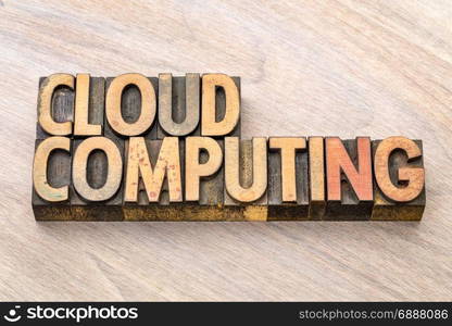 cloud computing - word abstract in vintage letterpress wood type blocks against grained wooden background