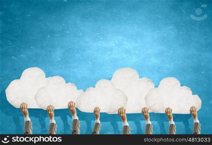 Cloud concept. Many hands of business people holding cloud concept
