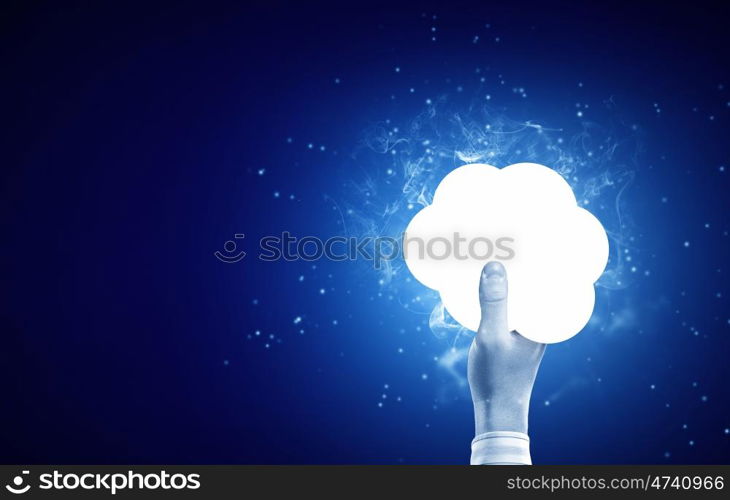 Cloud concept. Person hand touching glowing cloud on blue background