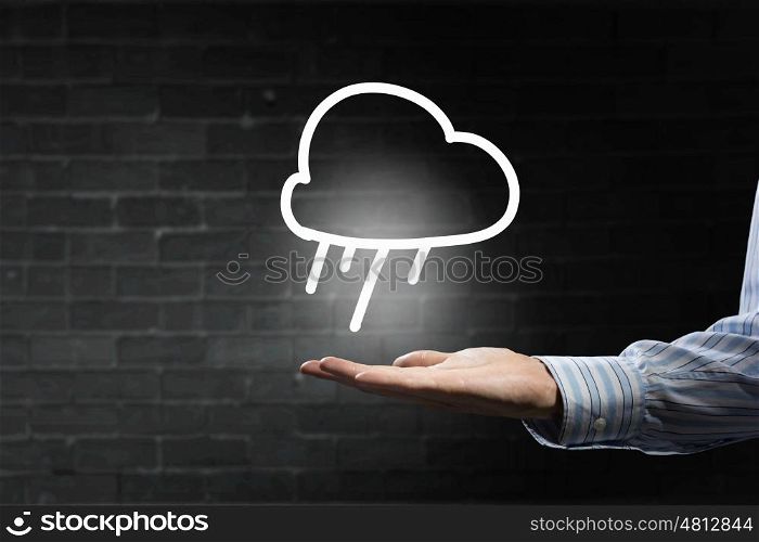 Cloud connection symbol. Businessman hand holding cloud computing concept in palm