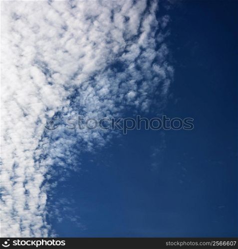 Cloud formations against blue sky.