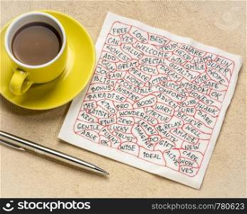 cloud of positive words - handwriting on a white napkin with a cup of coffee