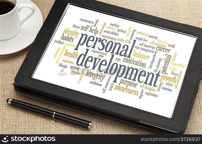 cloud of words or tags related to personal development on a digital tablet
