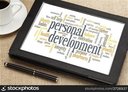 cloud of words or tags related to personal development on a digital tablet