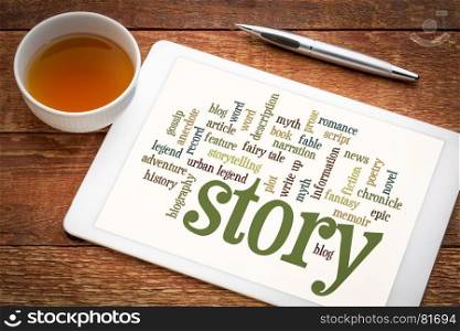 cloud of words or tags related to story, myth and legend on a digital tablet with a cup of tea