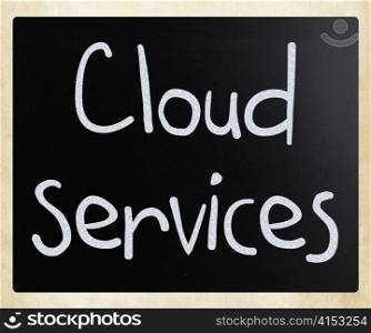 ""Cloud services" handwritten with white chalk on a blackboard"
