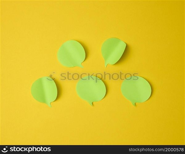 cloud shaped blank paper green stickers on yellow background