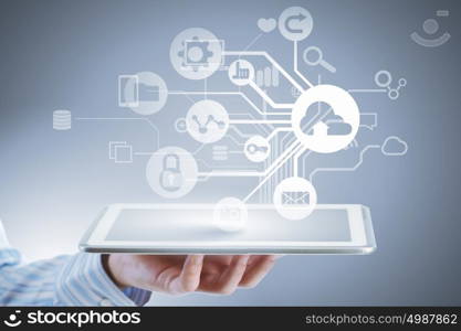 Cloud sharing and connection . Close up of businessperson using tablet representing cloud computing concept