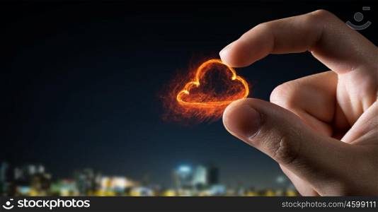 Cloud sign between fingers. Close view of male hand taking cloud sign with fingers