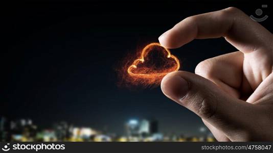Cloud sign between fingers. Close view of male hand taking cloud sign with fingers