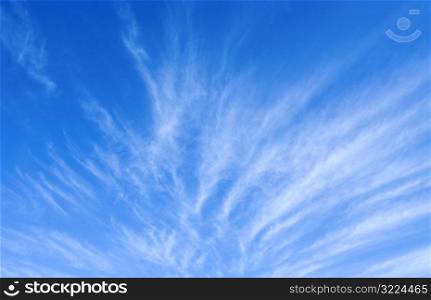 Cloud Streaks In Blue Sky