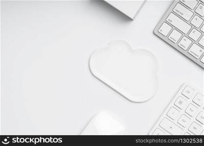 Cloud technology icon for global business concept from the top view on the workplace & desk