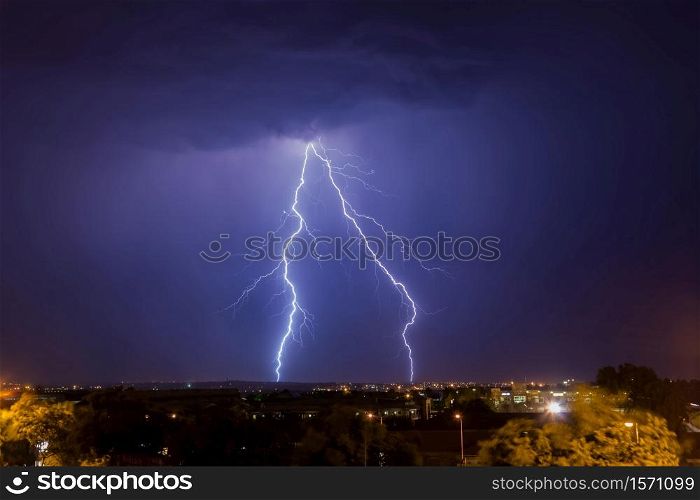 Cloud to ground lightning strike over Johannesburg at night time. This region of South Africa receives annual summer thunderstorms