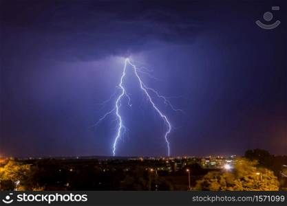 Cloud to ground lightning strike over Johannesburg at night time. This region of South Africa receives annual summer thunderstorms