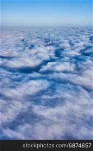 clouds and blue sky seen from airplane