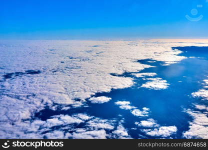 clouds and blue sky seen from airplane