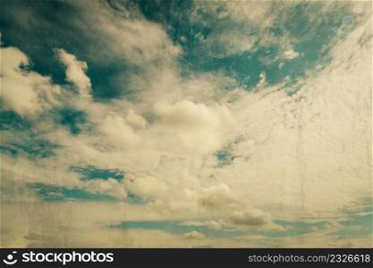 clouds and blue sky with grunge scratch effect vintage