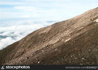 Clouds and slope of volcano Kerinci in Indonesia