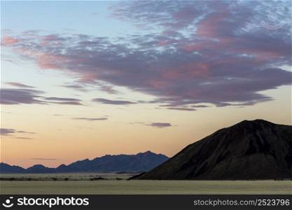 Clouds colored red after sunset Namib desert Namibia