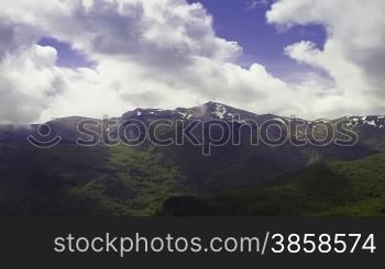 Clouds creation over a mountain forest