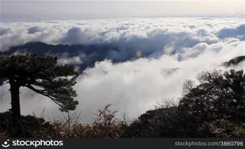 clouds crossing over mountain in China.