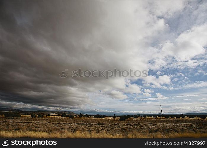 Clouds gathering over dry landscape