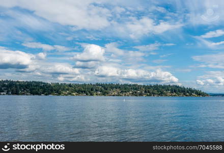 Clouds hover over Mercer Island, Washington. Shot taken from Seward Park.