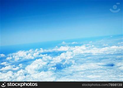 clouds in a blue sky, view from airplane