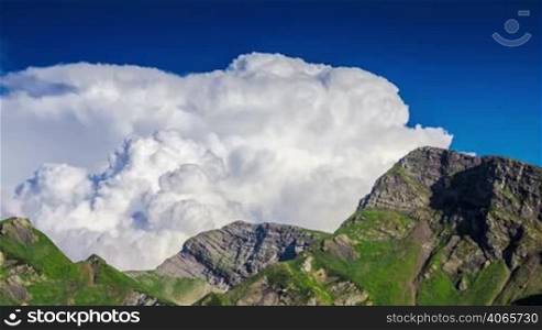 Clouds in blue sky and Kaukaz mountains 3 time lapse