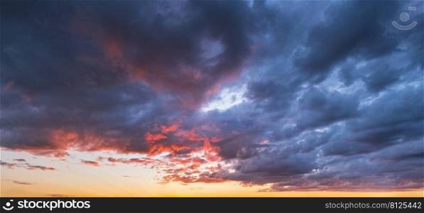 Clouds in evening dusk sky panoramic view. Climate, environment and weather concept sky background.