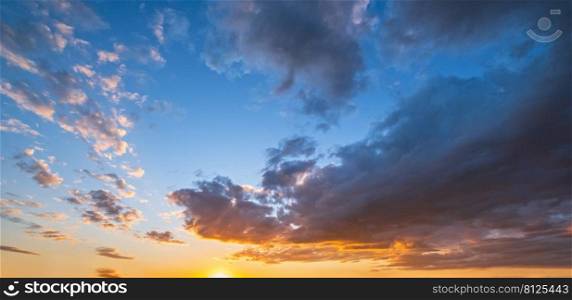 Clouds in evening dusk sky panoramic view. Climate, environment and weather concept sky background.