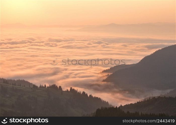 Clouds in the mountains at sunrise. Clouds in mountains at sunrise