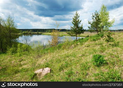 Clouds in the sky over the river Vilija in the spring afternoon.