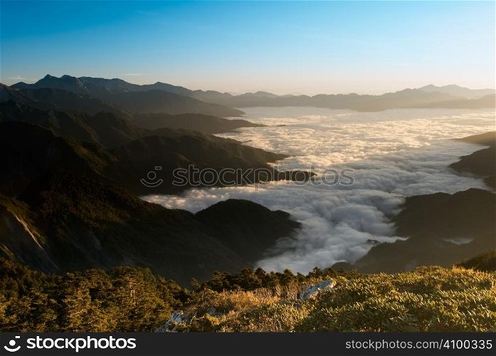 Clouds like the sea in high mountain landscape.