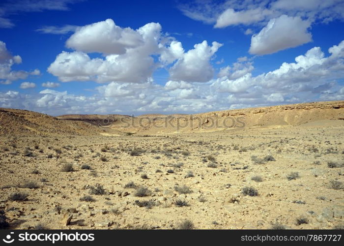Clouds on the sky and crater Ramon in Negev desert, Israel