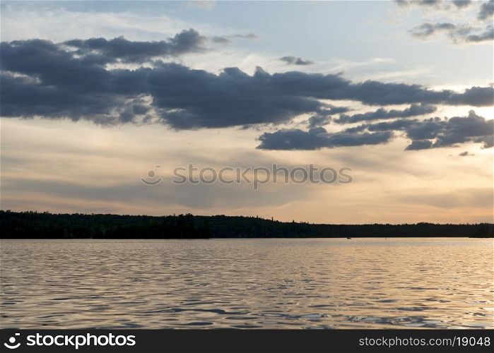 Clouds over a lake at dusk, Lake of The Woods, Ontario, Canada