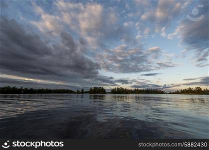 Clouds over a lake during sunset, Lake of the Woods, Ontario, Canada